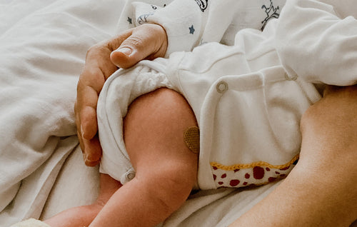 Mom hugging baby